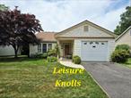 Welcome to easy living in the highly sought-after Leisure Knolls, a 55+ gated community in Ridge, NY. This charming 2-bedroom, 2-bath ranch offers a comfortable and convenient lifestyle with an attached garage and private drivewayâ€”no stairs, no hassle. Brand new Central Air System and Hot Water Heater. Inside, you&rsquo;ll find a spacious layout with a bright living room, a dining area perfect for entertaining, and a well-appointed kitchen. The primary bedroom features an en-suite bath and ample closet space, while the second bedroom is ideal for guests or a home office plus a relaxing screened in sunroom. Amenities link, copy and paste into your browser https://leisureknoll.org/amenities/Enjoy resort-style amenities just steps from your door, including a community pool, pickleball courts, and a vibrant clubhouse offering social activities and more. Whether you&rsquo;re relaxing at home or joining in the fun, this home offers the perfect blend of privacy and community.Don&rsquo;t miss your chance to own in one of Long Islandâ€™s most desirable active adult communities!