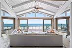 Set along the sandy shores of Quogue Beach, 174 Dune Road is a rare oceanfront offering with sweeping Atlantic views and easy access to everything the Hamptons has to offer.The main level has an open, airy layout with oversized windows that bring in natural light and frame the water views. The kitchen flows into the dining area and living room, where a sunken fireplace nook creates a cozy spot for gathering. The homeâ€™s octagonal design adds architectural interest and a great sense of space.Upstairs, the primary suite features dramatic ocean views, a spa-like bath, and a walk-in shower. Thereâ€™s room for everyone with additional bedrooms and three bunk rooms, making it ideal for entertaining family and friends.Outside, the deck offers plenty of space for dining, relaxing, or soaking in the sea air. The property also includes a private tennis court and separate guest quarters.Perfect as a summer getaway or year-round home, this is a rare chance to own on one of the most sought-after stretches of Dune Road.