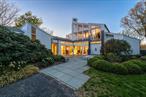 Perched on a 100-foot-high bluff with commanding views of Long Island Sound, this exceptional 3 + bedroom, 5 bath contemporary home is a rare fusion of design, privacy, and natural beauty. Originally designed and built in 1986 by architect Sanford Hanuer for his own use, the 3, 348 sq ft residence was completely reimagined in 2011, preserving its architectural integrity while introducing luxurious modern updates.Set on 2.45 acres with 190 feet of private beachfront, the home is sited at an angle to capture uninterrupted water views from every room. Floor-to-ceiling windows, bluestone and wide ash plank flooring, and three fireplaces create a warm yet sophisticated interior. The Eggersmann-designed kitchen with butlerâ€™s pantry is a chefâ€™s dream, and the homeâ€™s layout includes a loft and multiple decks and patios ideal for seamless indoor-outdoor living.The white-stained cedar exterior blends harmoniously with the surroundings. Below the home, a 50-foot pool with lanai and expansive deck is tucked 10 feet down the bluff, preserving both privacy and unobstructed views. Two + bedrooms are sectioned off to serve as a separate guest cottage.Every inch of this property has been thoughtfully designed to elevate the art of waterfront living â€” from floor to ceiling windows, white Italian marble bathrooms to golden-hour dinners on the patio overlooking the Sound. This is not to be missed!