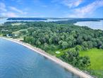 A once-in-a-generation opportunity to own one of the largest and last remaining open waterfront parcels on Centre Island. Spanning over 17 acres, this remarkable estate boasts over 500 feet of direct waterfront, with a long private beach offering panoramic views of Oyster Bay, Lloyd Neck, and the Connecticut coastline beyond. The grounds are a rare mix of expansive meadows, mature trees, a charming apple orchard, and gently rolling lawns that meet the shorelineâ€”an idyllic setting for future grandeur. Tucked throughout the property are four existing structures, three of which are significant architectural gems designed by The Architects Collaborative (TAC), the legendary firm co-founded by Benjamin Thompson and Walter Gropius, one of the fathers of modern architecture. These mid-century masterpieces present an unparalleled opportunity for restoration, reimagining, or inspiration for new construction. This parcel is a rare blank canvas with all utilities in place, including public water and a private well.