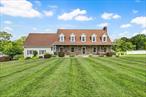 WOW!!! YOUR DREAM HOME JUST HIT THE MARKET!!! Custom-Built Cape with Over 4, 300 Sq Ft of total living space on 1.7 Private Acres!!! Welcome to this exceptional custom-built Cape-style home, proudly set on 1.7 acres of professionally landscaped grounds. Offering a peaceful setting with outdoor space to truly revel in natures beauty, this property combines quality, comfort, and serenityâ€”all just minutes from all major NYC commuting channels, award winning restaurants, wineries, farm stands and the areas best shopping! Enjoy the views of your incredible back yard while enjoying meals or coffee on your expansive rear deck. With over 4, 300 square feet of total living space, thereâ€™s room for everyone. The large eat-in kitchen features an abundance of cabinetry and flows seamlessly into the sun-filled formal dining room, which leads to a spacious family room warmed by a wood-burning stoveâ€”perfect for gatherings and cozy nights in. A first-floor room, currently used as a home office, offers flexibility for a guest room, playroom, or hobby space. Upstairs, the expansive primary suite serves as a private retreat with a beautifully updated ensuite bath and walk-in closet! Also on the upper level are two additional generously sized bedrooms, a full hall bath, and a bonus room complete with its own full bathroomâ€”ideal for guests or a second suite. The finished lower level offers truly versatile space with its own private entrance from the garage, a full bath, and a wet barâ€”perfect for recreation or extended family space. Pride in ownership shines throughout with numerous updates including a Lennox 17 SEER central air conditioning system, updated bathrooms, a brand-new driveway, new garage door openers, deck, invisible dog fence, new washer and dryer, and so much more. This home is a rare blend of quality, space, and locationâ€”offering the peace and tranquility of country living with the convenience of nearby amenities. Call today as properties this special and this well maintained truly do not come around often.