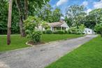 This unique property offers not one, but two separate dwellings on a beautifully half acre landscaped lot. The main residence is a well-maintained side-by-side split featuring 3 bedrooms, 2 full baths, hardwood floors, a cozy fireplace, and generous living space ideal for everyday comfort and entertaining.The second dwelling is a delightful 1â€“2 bedroom cottage complete with basement and attic and its own private yard and drivewayâ€”perfect for extended family, guests, or rental income opportunities.Enjoy outdoor living on the spacious back deck surrounded by mature trees, or unwind in the peaceful front yard on a dead end street. Whether you&rsquo;re looking for a multigenerational setup or an investment property, this versatile home is a rare find!