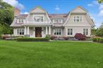 This luxurious, high-end custom residence, built by renowned Georgica builders, is located south of the highway in the estate section of Southampton Village. Its perfectly sited on 0.50 acres and is architecturally designed to include every amenity a Hamptons lifestyle can offer. This sprawling, gated, gambrel-style traditional gem includes 6 ensuite bedrooms and 8 full baths, boasting 6, 200 square feet of 2 stories with an impeccably finished interior and an expansive 2, 230 square feet of finished lower level. Entering the main floor foyer with double-height ceilings overlooking the 2nd floor balcony, all flows into an open-concept floor plan. The elegant first floor affords a seamless flow into the sun-filled gourmet chef&rsquo;s kitchen with premium appliances, custom cabinetry, marble counter tops, and an oversized marble center island with seating. The light-filled breakfast area looks out the wall of glass doors to the spectacular bluestone patio and 50 x 16 gunite pool, which includes an automated, heated Pentair system with an oversized swimmable gunite attached spa. Through the kitchen is a family room with custom paneling and a marble fireplace, all looking out to the professional manicured yard. This level is complete with a formal dining room with custom paneling, a 1st floor junior primary suite or den with an additional full bath across from the attached two-car garage. The upper level includes a private primary suite with a marble fireplace, marble bath with dual vanities, separate shower, pedestal tub, and walk-in closets with full built-in drawers. There are three additional ensuite bedrooms, one leading to a private outdoor balcony, and a spacious laundry room with sink and cabinets for storage. The lower level encompasses every amenity, which includes an ensuite bedroom, dining area, media room with marble fireplace, glass doors leading to a private gym area, an oversized den/game room with an additional marble fireplace, and a spectacular, enormous refrigerated beverage room. The outdoors include everything for summer enjoyment. The wrap-around blue stone patio leads to additional enclosed seating area with an outdoor fireplace for entertaining. Adjacent to the pool, set back from the main residence, is a pool house, studio space with a bar area, and full bath. Enjoy this fantastic home within close proximity to the beach, shops, and the restaurants of Southampton village and world class golf courses.