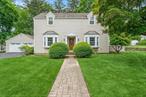 Not like all the others! This beauty has all of the charm of yesteryear along with all of the modern updates!  Step into this quintessential center hall colonial to a classic formal dining room and front to back living room, both with bay windows and sweet arched doorways. The kitchen has been all updated with rich wood cabinets and stain steel appliances including double wall oven and 6 burner stove. French door from the living room will lead you to a very special bright and welcoming sun room. The first floor also includes a bonus fifth bedroom adjacent to a gorgeous full bath with walk in shower. The second floor features 4 large bedrooms and 2 all updated full baths including a master en suite bath. On the lower level you will find an oversized full finished basement with lots of living space and lots of storage including a cedar closet for your special items.  The house also features almost 1200 square feet of decking, surrounded by white vinyl railings and individual indirect lighting.  You will also find an oversized 2 car garage attached to the house with a covered breezeway and flagstone pathway.  All of this is located on over 2/3 acre of gorgeous, level, property and circled by unique rock walls. If you are looking for something really special, this is it! Come see this one for yourself!