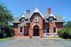 Historic Charm Meets Modern Luxury. Welcome to this brick home known as Eustatia (Greek for good place to stay) which is a rare example of a Victorian Gothic-style cottage that has survived in Beacon, situated on Monell Place in the northwest corner of the city. It was constructed in 1867 according to Frederick Clarke Withers&rsquo; plans for his friend John Monell, a state judge in New York (who is the namesake of the street today).  Important features of this 5 bedroom 3.5 bath spectacular home are:-Original parquet floors, dark walnut moldings, and marble entry; Grand rooms with soaring ceilings and ornate fireplaces; Renovated kitchen and family room with sweeping valley views; Nanny suite and spa-like master bath for ultimate comfort. The carved details, the handcrafted floors, even the old stone foundationâ€”all worth preserving as living history. Thatâ€™s the dreamâ€”rolling meadows, woodland privacy, and room to build your own personal paradise. Whether itâ€™s a pool for summer lounging, a tennis court for weekend matches, or a gazebo tucked into the trees for quiet reflection, this kind of acreage opens up endless possibilities. Metro North service from Beacon train station makes around 1 hour NYC Grand Central commutes or weekend escapes a breeze. Quick access to Route 84 connects you to the wider Hudson Valley and beyond. Beaconâ€™s Main Street is a cultural magnet, with galleries, boutiques, and farm-to-table dining. Just minutes from Dia Beacon, one of the countryâ€™s premier contemporary art museums. Itâ€™s rare to find a property that blends natural beauty, architectural charm, and urban accessibility so seamlessly. With nearly 5 acres of rolling land and panoramic views of the Hudson River, Newburgh-Beacon Bridge, and twinkling city lights, itâ€™s a showstopper.