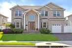 Welcome to this beautifully maintained brick Colonial located in the heart of Syosset, built in 2015 and situated within the highly sought-after Syosset School District. This spacious home offers 5 bedrooms and 4 full bathrooms, combining modern design with comfortable living.The main level features a bright and open layout, including a formal living room, elegant dining room, cozy family room, and an eat-in kitchen with ample cabinet spaceâ€”perfect for entertaining or everyday family life. A convenient first-floor bedroom and full bathroom provide flexibility for guests or multigenerational living.Upstairs, youâ€™ll find four generously sized bedrooms and three full bathrooms, including a luxurious primary suite with a walk-in closet and spa-like bathroom. The backyard is beautifully landscaped, offering a serene outdoor space for relaxation and gatherings.Located in a quiet and picturesque neighborhood, yet close to shopping, dining, parks, and LIRR. Donâ€™t miss this opportunity to own a newer, move-in ready home in one of Long Islandâ€™s most desirable communities!