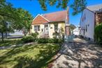 Welcome to this beautifully maintained Cape-style home situated on a spacious 40x100 corner lot in the heart of Auburndale, Flushing. This detached residence offers 4 generously sized bedrooms and 2 full bathrooms, a finished basement with a separate entrance providing comfortable living space for families of all sizes. Enjoy the convenience of a detached garage and a fully fenced yardâ€”perfect for outdoor entertainment, gardening, or pets. The home features a classic layout with a warm and inviting ambiance, offering plenty of natural light and flexibility. Well-maintained and full of potential, this property is ideal for families looking for room to grow, rental income, redevelopment, or long-term appreciation. Located just moments from St. Kevinâ€™s Church, St Nicholas Greek Orthodox Church, local shopping, a variety of restaurants, and major transportation options(bus to the subway, express bus to NYC) â€”including the LIRR Auburndale stationâ€”this home is ideally positioned for both everyday convenience and easy commuting. Donâ€™t miss this rare opportunity to own a move-in-ready home on a desirable corner lot in one of Queensâ€™ most sought-after neighborhoods.