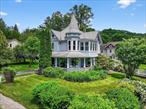 Victorian Elegance in the Heart of the CatskillsNestled beside a year-round stream and framed by mountain views, this circa 1890 Village Victorian is a graceful blend of timeless charm and thoughtful updates. Even the journey hereâ€”along the breathtaking Catskill Scenic Bywayâ€”feels like a retreat, where each passing mile draws you deeper into nature and a sense of ease settles in. Welcome to Margaretville, the gateway to all-season adventure in the Catskills.Positioned on a prized double corner lot, the home stands proudly with a classic wrap-around porch that invites you to linger, unwind, and take in the beauty of your surroundings. Inside, original woodwork and inlaid hardwood floors reflect the homeâ€™s rich heritage, while generous sunlight fills each room with warmth.The kitchen is bright and openâ€”perfect for gathering around the island to swap stories of the dayâ€™s hikes, ski runs, or riverside explorations. Four bedrooms, plus a flex space ideal for a fifth bedroom, office, or studio, offer flexibility for full-time living or weekend escapes. Begin your mornings with quiet reflection or yoga on the second-floor sleeping porch, where panoramic mountain views set a serene tone for the day ahead. Two RAIS wood-burning stoves add inviting warmth throughout.Outdoors, enjoy mature landscaping, a fenced vegetable garden, a firepit for cozy evenings, and ample lawn space for relaxation or recreation.With a proven track record as a successful Airbnb, this property offers both a personal sanctuary and income potential. Located in the heart of walkable Margaretville Village, you&rsquo;re just minutes from Belleayre Mountain, scenic trailheads, charming shops, farm markets, and all the natural beauty the region has to offer.Only 2.5 hours from the GWB, this is more than a homeâ€”itâ€™s your Catskill lifestyle, waiting to unfold.