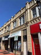 Excellent investment opportunity: Mixed-use building with one commercial unit and two residential apartments. Located in the busiest area of downtown Glen Cove. Currently fully rented on a month-to-month basis with no leases . Can be delivered vacant.