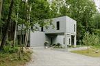 Introducing The High Hill Treehouse, an architect built concrete and glass showpiece located in the Hudson Valley. This love letter to art and design was conceived by husband and wife architect and design team Josh Pulver and Adele Abide of A+C Architecture and Vly Studio.Found at the end of a long private driveway and set amid 8.2 acres, the home was intentionally set at the base of a ridge to offer remarkable design and privacy while communing with the outdoors. Enter under a portico framed by concrete columns into the front hall. A full bath is found to your right, finished with Cleâ€™ zellige tile and Louis Paulson lighting. To your left a custom wooden screen encases stairs that lead to the second floor. A ground floor bedroom is found at the end of the hall, also suitable for a home office space. The proportions are generous and the floor to ceiling windows provide abundant light and calming views. The bespoke kitchen is found at the opposite end of the home and features Dekton countertops & island, a Miele induction stove and a counter depth Bertazonni refrigerator clad in paneling. The kitchen opens into a dining and living space where a wall of windows invites in the exterior landscape, flooding the space with light. Sliding doors exit to a stone patio that provides 900 square feet of exterior living space. Thoughtfully executed landscaping surrounds the exterior.Back inside, the switchback staircase leads to a generous 2nd floor landing. A primary suite and second en-suite bedroom flank the landing; each bathroom is designed in its own uniquely striking manner and high-end designer finishes. French doors off the 2nd-floor landing lead to a 600 square foot Ipe rooftop deck; calming, grounded and elegant.The home was built eco-consciously with sustainable rockwool insulation and energy efficient mechanical systems. Mitsubishi Hyperheat ceiling cassettes provide heating and cooling throughout the home and a tankless Navien boiler offers on-demand hot water. Top of the line Marvin windows and doors ensure added efficiency while engineered oak floors add warmth to the interiors. Thoughtful design, striking architecture and new construction all blend seamlessly with a private setting to deliver a stunning new home experience in the Hudson Valley. Easily accessible yet private â€” 15 minutes to the villages of Rhinebeck / Rhinecliff and under 2 Hours to NYC.
