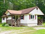 Clean, neat and cozy. This well kept mobile home is situated on a quite country lane on 1/2 acre of level lawn. Great spot, great home. Featuring 2-3 bedrooms, 1 full bath, Living room, kitchen. Lovely front covered porch and back covered deck add additional outdoor living space. A really sweet home.  Only 2 hours NYC, close to area conveniences, Eldred shopping, Barryville Farmers market, schools and more.