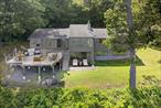 Paradise retreat with breathtaking panoramic water views of the Hudson River from every room. This impeccably renovated home has spared no expense, featuring Caesarstone throughout its generous floor plan and top-of-the-line Sub-Zero, Wolf, and Viking appliances in a dream kitchen. The open layout is perfect for entertaining or simply enjoying the stunning views as ships pass by. An abundance of natural light floods the space, enhanced by cathedral ceilings that are truly unmatched. Additionally, there is a unique office/den enclosed in glass, allowing you to appreciate all aspects of nature.The main entry floor showcases a spacious primary suite, complete with a luxurious en-suite bathroom and two walk-in closets. The ground level offers a private patio overlooking the Hudson River, a fireplace, two additional bedrooms, a workshop, a laundry room, and extra storage space.The exterior of the home features an outdoor sanctuary equipped with a built-in grill and a spacious craftsman deck. It also includes a full-house generator. A private, tree-lined driveway leads to an oversized detached two-car garage, connected to the magnificent home by a covered breezeway.*Please note that the floors shown are sold as is.*