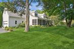 Welcome to this beautiful, spacious home in the heart of Cutchogue. Most notably, the Hampton Jitney is within walking distance, making travel exceptionally convenient. Just a short distance to the LIRR, charming local shops, restaurants, beaches, wineries, and farm stands. A 30 minute drive to the Hamptons! Across the street from a country club that features golf and tennis. This home is approximately 2, 500 square feet on a 0.5 acre lot and features a 2 car attached garage, 4 bedrooms, and 5.5 bathrooms. Each bedroom has its own private bathroom, including a first floor primary suite. The living room and dining room are both large and inviting. The living room has a wood burning fireplace. The kitchen is fully equipped with granite countertops and new stainless steel appliances. The backyard has plenty of privacy and features a large saltwater inground pool and an outdoor fireplace. The front yard has a large screened-in porch that spans the entire length of the house. The partially finished full basement has egress windows, one full bathroom, and an indoor and outdoor entrance. The home is quiet since itâ€™s deeply set back from the Main Road. The sole driveway is on Crown Land Lane. This home is perfect for a primary residence, weekend getaway, profitable rental, or as a profitable bed and breakfast. Donâ€™t miss the opportunity to own this beautiful home! Occupancy can begin 10/15/25.