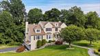 Welcome to this absolutely stunning four-bedroom Colonial, perfectly situated on a peaceful cul-de-sac and set on over two beautifully landscaped acres. With professional landscaping, mature plantings, and tranquil surroundings, this home offers both privacy and elegance. As you step into the gracious two-story foyer, youâ€™ll be immediately impressed by pristine hardwood floors, soaring ceilings, and exquisite custom moldings that flow throughout the home. Designed for both everyday living and grand entertaining, the spacious living room features a warm gas fireplace and seamless flow into the gourmet kitchen. The kitchen is a chefâ€™s dream, complete with high-end stainless steel appliances, quartz countertops, a large center island, and a generous walk-in pantry. Thoughtful lighting includes recessed fixtures, wall sconces, and elegant chandeliersâ€”complete with a motorized lift for easy maintenance.A flexible main-floor office with a full bathroom offers the potential for a guest bedroom. The dedicated laundry area adds convenience and extra storage. Upstairs, the luxurious Primary Suite features a sitting room, expansive walk-in closets, and a spa-like four-piece bathroom. Three additional generously sized bedrooms and a well-appointed full bathroom complete the second level.The daylight lower level includes a meticulously maintained mechanical room, walk-out access, and direct entry to the oversized three-car garageâ€”offering endless potential for a gym, media room, or recreation space.This exceptional home combines luxury, function, and location. Ideally located for an easy commute and close to highways, train, top-rated schools, shopping, hiking trails, and more. Don&rsquo;t miss your chance to make this remarkable property your forever home.