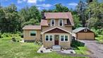 Professional photos coming 7/16. If you have an appreciation for the old mixed with the new than you will enjoy this 1930&rsquo;s cape renovated in 2020. Some of the old original features include hardwood floors, stone fireplace, screened in three season front porch, and refinished banister and railing to the second floor. Some of the newer features include a roof in 2024, siding and gutters in 2022, fireplace liner and spark arrestor in 2023, new updated kitchen, along with two full updated baths in 2020. Third bedroom on the first floor conveniently has an adjacent bathroom and is currently being used as a familyroom or can double as a home office. Brand new in 2020: propane furnace, hot water heater, insulation, sheet rock, pressure tank, well pump, appliances. New electric service to the house and all new wiring and plumbing. Includes additional vacant lot of .37ac