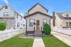 Impeccably Maintained Home on A Beautiful Residential Block. This turn-key property nestled is a charming neighborhood lined with well kept homes, reflecting true pride of ownership and a strong sense of community. Conveniently located near the LIRR, JFK Airport, local police precinct, schools major malls, popular restaurants and Nassau County Border., A Must See - Fall in Love the moment you walk through the door!