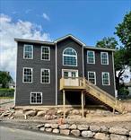Step into the dramatic 2 story entry of this Brand NEW Center Hall Colonial overlooking the scenic Lowland Hill park in beautiful and historic Stony Point, NY. An impressive double door entry welcomes you into the spacious center hall with sunlight streaming in from the huge Palladium window. You can&rsquo;t help but be impressed with the high end custom oak and iron railings accentuating the dramatic staircase, the gleaming hardwood floors and the raised panel doors.  Entertaining is a breeze with the spacious Formal Living and Dining Rooms while friends and family gather around the kitchen island. The light and bright custom kitchen features sleek contemporary cabinets with oversized cabinet hardware, quartz countertops and a stainless sink with modern faucet. Heading upstairs your Primary Bedroom suite offers cathedral ceilings, a generously sized walk in closet and private Bath. 3 other spacious Bedrooms and a second full custom Bath complete this pretty picture. There is even a Laundry/Utility area on the upstairs level for added convenience. Hardwood floors are featured throughout this home - including all Bedrooms. Central air too! On the lower level of this home you will find a bonus room that could easily be finished into a playroom, second family room or home office - and a large 2 car garage. Stony Point is a scenic Hudson River town boasting marinas, an Actor&rsquo;s Equity theater, the historic Stony Point Battlefield and Lighthouse and only 35 miles to Manhattan via the Palisades Interstate Parkway or the convenient NY Waterways Ferry!