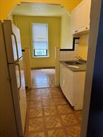 Discover this sun-drenched 1 bedroom coop with lots of natural light. This charming home features hardwood floors, high ceilings, an inviting eat-in kitchen, and a modern upgraded bathroom. Ample closet space for your storage needs. With a little TLC, this unit presents a fantastic opportunity to customize and make it your own! Located one block from the iconic New York Public Library, this elevator building offers peace of mind with security cameras on every floor, a resident super, and a convenient on-site laundry.Additional storage units are available for rent. Perfectly positioned near #2 and #5 trains (Allerton Ave station) and the #11 express bus to Manhattan, with shops and schools nearby. Monthly maintenance includes all utilities, and this pet friendly building welcomes your furry companions. Note: Cash-only purchase due to the original 1928 bylaws. Seize this rare chance to create your dream home in a classic NY setting!