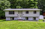 Charming Raised Ranch in Prime Poughkeepsie Location â€“ Fully Updated & Move-In Ready!Welcome to this beautifully updated classic raised ranch nestled in the highly desirable Sutton Park neighborhood of the Town of Poughkeepsie. Located on a quiet cul-de-sac, this home offers the perfect blend of comfort, style, and convenienceâ€”ideal for families, commuters, and anyone seeking a peaceful yet well-connected community.Step inside to find a sun-drenched kitchen featuring rich granite countertops, charming cabinetry, a skylight, and sliding glass doors leading to your private deckâ€”perfect for morning coffee or evening gatherings. The cathedral ceilings in the open-concept living and dining rooms add a spacious, airy feel, complemented by gleaming hardwood floors throughout all bedrooms.Both the hall bath and the primary half-bath have been tastefully upgraded with granite counters and skylights, bringing in beautiful natural light.Downstairs, enjoy a fully finished lower level with a modern full bathroom, luxury jacuzzi tub, granite vanity, and stylish tilework. A separate laundry room, family room with new marble floors, and walk-out access to a charming marble patio make this level perfect for entertaining or multi-generational living.Recent upgrades include:â€¢ New roofâ€¢ Stone sidingâ€¢ Fresh exterior paintâ€¢ Marble flooring in the family roomâ€¢ Adorable backyard playsetEnjoy all the benefits of central air, city water & sewer, and natural gas, plus the safety and privacy of a quiet cul-de-sacâ€”great for kids to play freely.This home is ideally located just minutes from Metro-North Train Station, Route 9, Galleria Mall, top-rated schools, shopping, and parks.Donâ€™t miss outâ€”schedule your showing today and make this beautiful home yours!