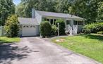 Welcome to your very own private oasis conveniently located right in the center of the Town of Poughkeepsie. The fully fenced back yard will â€œwow youâ€. Here you will find a gorgeous 18 x 36 foot inground pool surrounded by beautiful landscaping, a stunning Koi Pond with a soothing waterfall feature, an expansive deck, a shed and a large, level yard ideal for outdoor enjoyment.  As you enter the front door, you will be captivated by the soaring ceiling and full view of the living room below. The entry level offers a dining room and a beautifully updated kitchen which boasts Kemper cabinetry, Silestone counters, a tiled backsplash and a generous dine-in area. The lower-level living space offers the perfect space to spread out, entertain, watch TV or simply relax in front of the cozy fireplace. There is also a half bath and a versatile extra room on this level from which you can access the large, screened porch. The top floor offers three bedrooms, all with plantation blinds, and a nicely renovated full bath with a jetted tub. This lovely home is located close to all amenities, shopping, restaurants, hospitals, major highways, the Poughkeepsie train station and all that the fantastic Hudson Valley has to offer.