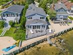 Mattituck, North Fork â€“ Bayfront Treasure in Historic Camp MineolaExceptional Value â€¢ Private Beach â€¢ Transferable Rental PermitJump into the North Fork lifestyle with this captivating bayfront retreat in the charming and historic Camp Mineola community of Mattituck. Featuring nearly 50 feet of private sandy shoreline and panoramic views of the Peconic Bay, this four-bedroom waterfront home offers a rare combination of tranquility, character, and investment potentialâ€”all at an outstanding value.Originally established in the early 1900s to rival the nearby Salt Lake Village, Camp Mineola has gracefully evolved from a seasonal bungalow enclave into a highly sought-after neighborhood blending timeless charm with modern convenience. Nestled within the hamlet of Mattituck in the Town of Southold, the community offers a peaceful, coastal setting just minutes from some of the North Forkâ€™s most beloved destinations.As you arrive, the fresh salt air and soft bay breezes welcome you. A picturesque pea-stone driveway leads past a detached garage and into a picket-fenced front yard bursting with lush emerald lawn, vibrant hydrangeas, and summer blooms. The raised front porch sets the tone for whatâ€™s insideâ€”a warm and inviting home designed to celebrate the beauty of its waterfront setting.Inside, the open-concept main level is ideal for relaxed living and seamless entertaining. The sun-filled great room flows effortlessly into a dining area and thoughtfully designed kitchen with a breakfast bar. A comfortable lounge area includes bonus refrigeration, perfect for serving the expansive south-facing terrace overlooking the bayâ€”with private stairs leading directly into the water.This level also offers a spacious first-floor bedroom, full bath, pantry, laundry room, mechanicals, and ample closet spaceâ€”ideal for hosting guests or single-level living.Upstairs, wake up to breathtaking, 180 degree water views from any of the three additional bedrooms. Enjoy brilliant sunrises and the peaceful sounds of the bay, with vistas that stretch from Robins Island to James Creekâ€”where boat slips and shares are available through nearby Strong&rsquo;s Marina.Additional features include:-A fully fenced yard, perfect for pets or young children-A large detached garage/storage building-An outdoor shower for rinsing off after beach outings, paddleboarding, or morning runsCamp Mineolaâ€™s low annual dues (approx. $300/year) cover association amenities and road maintenance. Located just minutes from the vineyards, farm stands, boutique shopping on Love Lane, and acclaimed local restaurants, this home offers a relaxed yet refined lifestyle with easy access to the Hamptons and NYC.A Rare Investment Opportunity:This property includes a transferable Southold Town rental permit, allowing you to generate income through vacation rentals of a minimum of 2-week compliant stays â€”a unique value-add in this high-demand market.Low taxes, historic charm, and unbeatable water access make this one of the North Forkâ€™s best waterfront buys. Whether you&rsquo;re searching for a full-time residence, vacation home, or income-producing property, this Mattituck gem delivers on every level.Donâ€™t miss this rare opportunity. Call today to schedule your private showing.Buyer broker participation warmly encouraged.