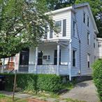 Large 3-bedroom updated Apartment featuring an open floor plan, hardwood floors, large kitchen and primary bedroom, washer & dryer in unit.
