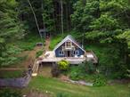Welcome to 101 Porcupine Road â€” Your Private Catskills RetreatTucked away in the heart of the Catskills, this hidden gem offers the perfect blend of seclusion, scenic beauty, and modern comfort. Surrounded by lush woodlands and rolling hills, this more-than-three-acre hillside property is a true sanctuary for nature lovers and those seeking peace and privacy.Take in sweeping views of the Sundown Wild Forest and the iconic Table and Peekamoose Mountains from the comfort of your wrap-around deck â€” the ideal spot for morning coffee or evening stargazing. Inside, youâ€™ll find a sun-drenched, open layout with spacious living areas perfect for entertaining, family gatherings, or quiet nights by the fire.The home features a well-appointed kitchen, two comfortable bedrooms, and a versatile bonus room thatâ€™s ideal for a home office or additional guest space. Oversized windows throughout the house frame the serene landscape, bringing the outdoors in year-round.Venture up the hill to a screened-in gazebo with potential for transformation into a charming sugar shack â€” take advantage of the many mature maple trees that dot the property.Just minutes from the Neversink Reservoir, this location is a haven for outdoor enthusiasts with easy access to hiking, fishing, boating, and more. Youâ€™re also conveniently close to local favorites like Blue Hill Lodge & Caf&#233;, the Grahamsville Deli, the Russian Mule Brewery & Restaurant, and the Claryville Art Center.Whether youâ€™re seeking a private year-round residence, a peaceful weekend escape, or a top-tier vacation rental opportunity, 101 Porcupine Road delivers the best of the Catskills in every season.Schedule your private showing today and discover the magic of this one-of-a-kind mountain retreat.
