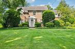 Charming Colonial in Coveted Robbins HillWelcome to 21 Orchard Drive, nestled in the heart of East Willistonâ€™s sought-after Robbins Hill neighborhood. This classic 4-bedroom, 3.5-bath Colonial blends timeless character with modern comfort. Beautifully set on a manicured lot, the home features rich hardwood floors throughout and sun-filled spaces designed for both everyday living and elegant entertaining.The main level offers a gracious flow with a formal dining room, an inviting living room with wood-burning fireplace, a cozy breakfast room, powder room, and a cheerful kitchen ready for your personal touch. Upstairs, youâ€™ll find a serene primary suite with a full bath and access to a walk-up attic, two additional bedrooms with a shared hall bath, and a fourth bedroom with an en-suite bath and its own private staircase â€” ideal for guests or an au pair.Additional highlights include central air conditioning, forced-air heat, a 1.5-car garage, and a full unfinished basement offering ample storage or future potential. Outside, enjoy a lush backyard and patio space perfect for relaxing or entertaining.Just moments from the LIRR, Village library, parks, tennis courts, restaurants, shops, and places of worship â€” all within the award-winning East Williston School District. This is more than a home; itâ€™s a lifestyle in one of Long Islandâ€™s most desirable communities.