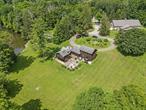 SELLER FINANCING AVAILABLE>The Adirondack is YOUR Perfect Waterfront Getaway. Tranquility, endless possibilities and the warm vibes of the Hudson Valley welcome you. Situated on 1.951 acres along the majestic Ten Mile River. The home features an Old World charm with custom woodwork, built-in-cabinets, hardwood floors, a unique stone fireplace and your very own private balcony overlooking the spacious backyard. Imagine cool evenings sitting around a fire pit on the custom stone patio, kayaking down the river on sunny days. First floor offers a galley kitchen, dining room large enough to seat twenty people, a half bathroom perfect for wet feet. Second floor a spacious living room with a cozy wood burning fireplace, a bedroom, full bathroom, linen closet, another guest bedroom with double closets. The master bedroom, walk-in closet, bathroom and private balcony. Mud room with washer/dryer hook-up. Third floor features an enormous open-beam with two ceiling fans, and skylights. This room is perfect for numerous bunk beds, yoga, your home office, writing, perhaps a media room or your very own private library.