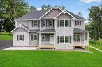 Welcome to a new colonial home in Meadowbrook Estates,  where you can live with luxury style and the tranquility of one of the best community; located just 10 minutes from Salisbury Mills train station and 10 minutes to Stewart Airport and in the Cornwall School District. 20 minutes to West Point. 1 hour to NYC. The 1st floor, offers a gourmet kitchen with brand new stainless steel appliance package, stainless steel direct vent hood above range, Waypoint 400 Series custom cabinetry w/painted & glazed options, granite and quartz countertops, apron sink white, tile back splash and massive island, main sink, gas range, 1/2 bath off kitchen, inviting you to enjoy the stunning island, living in a peaceful place with gorgeous sunrises and sunsets that you can see from the tranquility of your home, has wooden flooring throughout first and second floor hallway, stairs with oak treads w/pine risers & craftsman-style post and decorative iron spindles, 36 gas burning fireplace, open family dining and living room, 2nd floor-Master bedroom, glorious enormous master bath overlooking and with separate shower with fine porcelain tiles floor to the ceiling with frameless shower glass door and seat, and a beautiful american tub by American Standard, Delta 8 Spread faucet, double vanity, 3 other bedrooms with quality carpets floors, all with spacious closets, modern doors and big windows that permit the outside light in to make everyday a bright day; a shared center hall full bathroom and laundry room on second level. Basement/lower-walk out, with space to storage, make an office or additional family room/library, large storage and boiler room Additional Information: Amenities: Shower with fine porcelain floors in the main bathroom, tub, Attic for storage, Parking: 2 Car attached garage with painted walls and ceilings, authomatic doors openers with insulated steel overhead doors. Outside you ca enjoy a beautiful view with grass and trees in front of the house including an automatic lawn sprinkler system (soded area only), front paved walkaway. Water proof foundation below grade with footing drains, Poured concrete foundation walls, Vinil siding &sofits w/aluminum fascia, decorative trim. Don&rsquo;t think it twice and make this dreamed modern house your new home.