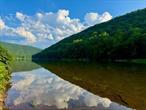 PARADISE FOUND! 25 spectacular acres with 900+ FEET OF WATERFRONT on the pristine main stem of the world famous Scenic Upper Delaware River. Words cannot begin to describe the beauty and serenity of this incredibly special property. Trout jumping, bald eagles soaring overhead - you&rsquo;ll feel like you&rsquo;re in your own National Park. Build your dream home or enjoy the waterfront camping sites and large entertainment pavilion -- or both! Situated on a blissful, slow moving stretch or river called Doyles Eddy, this property can feel as much like a lakefront as a riverfront. With your own in and out boat ramp, access to the river is easy, whether for a refreshing swim on a hot summer day or to launch a kayak or armada of inner tubes for a fun time out on the river. Then, of course, there&rsquo;s the fly fishing... literally considered the best in the Eastern U.S. Conveniently located less than 3 miles from Hancock, NY, awarded the Best Small Town in America by TimeOut magazine, you&rsquo;re just a short drive to all the amenities you&rsquo;ll need, but you&rsquo;d never guess you&rsquo;re so close to civilization.In addition to the waterfront camping amenities, this property also includes a Beaver Mountain Log storage shed. Electric service is already connected and there&rsquo;s a dug well that is not currently in service.Owned by the same family for 80+ years, properties like this come along once in generations. Make it yours before this rare opportunity is gone!