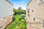 Rare opportunity to own a generously sized lot with mature greenery and existing paved access. Ideal for building a custom home or expanding your living space. Quiet setting with plenty of room for outdoor enjoyment, gardening, or future development. A blank canvas in the heart of the neighborhood.