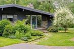 At the end of a long, private drive, this elegant mid-century home sits tucked into six acres of open lawn, forest, and filtered light. Inside, vaulted ceilings with exposed beams, hardwood floors, and a striking double-sided stone fireplace anchor the living spaces. Oversized windows frame views of the surrounding landscape like living artwork. The main level offers two spacious bedrooms, each with soaking tubs and large closetsâ€”one with direct access to the patio and hot tub. A full bath with vintage charm, a bright updated kitchen, and a separate den complete the floor. Downstairs, a spiral staircase leads to a finished lower level with polished concrete floors, another full bath, a cedar sauna, and flexible space for guests or hobbies. The grounds are immersive and unexpected: footbridges crossing still ponds, a tiny house, outdoor shower, outhouse, and space to wander, reflect, or connect. The hot tub is thoughtfully built into one of the floating decksâ€”perfect for soaking under the stars. The tiny house is outfitted with a king-size platform, electricity and a stone slabâ€”just waiting for a wood stove and your dreamiest vision. A carport, shed, garden with raised beds, and fire pit round out the offering. Furnishings available separately, should you want to move right in and start enjoying. Under 90 minutes from the GWB and surrounded by the best of the Catskills. You&rsquo;re just 10 minutes to Hemlock Neversink and 15 to YO1â€”two of the region&rsquo;s most serene, full-service wellness spas. Skiing at Holiday Mountain, entertainment at Resorts World, and live music at Bethel Woods are all within 15-25 minutes. With Livingston Manor, Narrowsburg, and Ellenville just a short drive away, this spot offers the perfect blend of peace, play, and possibility.
