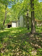 Welcome to your private retreat, complete with 5+ acres of nature. The contemporary home features 3 bedrooms and two full baths. The living room is a flexible space with dining area options, as well as a wood-burning stove perfect for cozy winter days. . A wall of windows invites you to seasonal views and outdoor activities, while the deck off the living room is ideal for morning coffee or evening views of the night sky. The second floor features 2 bedrooms, with ample closet space and newly renovated full bath. A 2-car garage and full basement are perfect for extra storage and workshop hobbies. The high-fenced, enlarged garden, perfect for green-thumb enthusiasts, awaits your ideas and visions. But wait, thereâ€™s moreâ€¦An additional feature of this property is a large barn with hayloft and electric which could be used for family parties and gatherings! Please see updates on separate document.Close to shops, parks and the Taconic Parkway. Call today for scheduling your tour of this amazing property. 24-hour notice is appreciated.