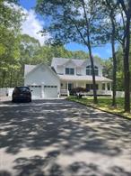 STUNNING Victorian located in highly desirable Manorville neighborhood. This meticulously maintained gem built in 2000 and perfectly set on 2.2 acre lot (with the possibility of subdivision) boasts 4Br, 3.5 Bths, huge DR with Bay window, sunken LR, EIK with Island, granite tops, tiled backsplash, S/S appliances and crown molding. EIK is open to den with gas Fpl & Hi-hat recessed lighting. Hardwood flrs in LR, DR, Den, upstairs hall & 3 Brs. Master bedroom is illuminated with large palladium type windows and has vaulted ceiling. Large BR over 2 car garage has 2 skylights. Premium Anderson windows throughout. Large finished bsmt with OSE, full bath (everything is COâ€™d). New tankless Navien gas 3 zone hot water heating system. Beautiful wraparound porch with entry door to DR. Huge rear deck, fenced yard, in-ground sprinkler system which can use public water or well with new pump. 2 car insulated garage doors with electric openers. Oversized driveway can accommodate multiple vehicles.Close proximity to Sunrise Hwy and LIE. Survey attached. Horse property. Star exemption $1011.90