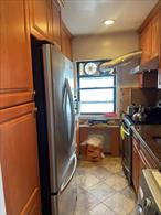 This is a spacious 1-bedroom, 1-bathroom apartment located in a desirable neighborhood. The dining area features a window that brings in abundant natural sunlight. The washer and dryer are grandfathered in, making laundry convenient. The bathroom is BRAND NEW!!! Conveniently located near Cunningham Park, supermarkets, restaurants, shopping, AMC movie theater, schools, and more. Low monthly maintenance of $906.52 includes all utilities except electricity. Garage parking s available for $140/month â€” no waitlist. Cats are welcome, but no dogs please. Renting allowed in one year. Minimum income for cash buyers: $75, 000. Debt-to-income ratio must be 25% or lower. A must-see!
