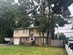 Contract Vendee, As-Is, Being Sold Occupied. 5 bedroom, 3 full bath wide line hi ranch in Harborfields School District. Upstairs features 3 bedrooms, 2 full baths, EIK, Dining room and den with vaulted ceilings. Downstairs has an additional den, 2 bedrooms, full bath, laundry room and 1 car garage.
