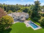 Welcome to 42 Mamaroneck Road, a magnificent iconic estate ideally located in the heart of Scarsdaleâ€™s prestigious Murray Hill neighborhood. This impressive property is accessed by a long and supremely private circular driveway enhanced with mature and pristine specimen trees delivering a dramatic sense of arrival. Nestled on 1.5 acres of lush, level, and perfect property, this magical residence has been completely recreated in 2025 and seamlessly blends timeless curb appeal with modern interiors designed for todayâ€™s most sophisticated and discerning buyers.A luminous two-story entrance hall with herringbone floors and a wide sculptural staircase with sleek glass railing sets an inviting and airy tone. The center hall layout offers a well-proportioned living room with a marble fireplace for elegant gatherings. A spacious formal dining room with a custom-crafted butler&rsquo;s pantry and wet bar adjoins the luxurious eat-in kitchen. The expansive open-concept kitchen features a large center island with waterfall quartzite countertop, Thermador appliances, including 2 dishwashers, multiple ovens, and range with custom hood and pot-filler, opens to a sun-filled breakfast area and family room with double glass doors to the heated covered porch, pool and property. A large mudroom with shiplap panels includes built-in seating, storage, a walk-in pantry, a full bathroom, and a modern staircase with a glass railing is conveniently positioned off the kitchen. The formal powder room, wood paneled elevator, and incredible indoor wellness area with an indoor pool and 1st floor bedroom/pool cabana complete the main level.Indulge in your own year-round wellness resort and private sanctuary. Thoughtfully designed for relaxation and rejuvenation, the stunning indoor pool features a soaring 2-story vaulted ceiling with custom millwork and 3 exposure views offer generous natural light. The pool/spa includes an endless swim current, a full Jacuzzi, radiant heated floors, automatic cover, and temperature and light controls, and an adjoining full bathroom with a steam shower. Additional versatile spaces ideal for a gym, bedroom, or pool cabana offer a serene luxury retreat without leaving your home.Outside, park-like, level, and well-screened property offers a private oasis with abundant space for outdoor living and entertaining.The spectacular backyard features a sparkling 40â€™ x 20â€™ Gunite pool with an integrated spa, sun shelf, and automatic cover with a patio and fire-pit surrounding the pool. An expansive patio spans the length of the residence and includes a heated covered porch with an outdoor fireplace, and a fully-equipped, built-in outdoor kitchen. The 2nd level reveals a spectacular primary suite with vaulted tray ceiling, a large private deck overlooking the property, a sitting room/office, a wet bar, and a luxurious spa bathroom complete with a floating soaking tub, an oversized shower, dual vanities, and 2 custom walk-in closets. 4 additional bedrooms with 3 full bathrooms include a generous ensuite guest bedroom with vaulted ceiling. A gathering/recreation area, and a stylish laundry room with dual washer-dryers add convenience, function, and complete the 2nd level.Accessible by the elevator, the finished lower level offers great flexibility with a large recreation space, kitchenette, gym, pre-wired media room, powder room, ensuite bedroom with full bathroom, and ample storage space. The home is smartly equipped with a Lutron HomeWorks system, Generac generator, and an 8-zone HVAC system. Nestled on 1.5 acres in the heart of Scarsdaleâ€™s Murray Hill neighborhood, this turn-key estate offers serenity, modernity, and the amenities of your dreams. Located in the award-winning Scarsdale School District, 42 Mamaroneck Road in Scarsdale presents an extraordinary opportunity for privacy, prestige, and year-round resort-style living all within 35 minutes from New York City!