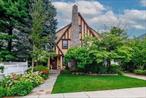 Tucked away on a peaceful, private cul-de-sac in the desirable Harvard section of Rockville Centre, this 4-bedroom, 2.5-bath Tudor offers timeless character, abundant space, meticulous and thoughtfully curated upgrades and updates across 2, 700* square feet (including Third floor and basement), priced to sell. Light-filled and inviting, the home blends classic architecture with modern comfortsâ€”perfect for todayâ€™s lifestyle.The heart of the home is a custom-built chefâ€™s eat-in kitchen, featuring granite countertops, a commercial-grade gas oven, tile backsplash, stylish granite computer desk workspace and lighted cabinets throughout. This open flow floorplan leads into the dining room which features a built-in granite top lighted breakfront and wine rack, and a cozy Swedish wood-burning stove adding warmth and functionality; while a screened-in porch just off the dining area leads to a serene backyard oasis with a spacious deck with canvas awning, ceiling fans, natural gas BBQ, hot tub, and privacy fencingâ€”ideal for entertaining or unwinding.The main level also includes a large living room with a ductless gas fireplace, a cozy den, mudroom, and powder room.Upstairs, youâ€™ll find a main bathroom and four generously sized bedrooms, including a primary suite with two walk-in closets (one doubling as a dressing room) and a private bath. One bedroom offers a lofted spaceâ€”perfect for a home office or creative nook.The airy, very sizable third floor finished walk-up adds incredible flexibility, family room, hobby space, or gym, complete with built-ins and closet, split A/C system, and a portable heating unit. The attic above has an exhaust fan built into the roof.The finished basement area has an open room and storage room. The remaining basement has laundry, further storage, closets, and work area with bench, providing even more room to tailor to your needs.Additional highlights include a two-car detached garage with remotes, dry well in driveway, Generac whole-house generator (excluding A/C and hot tub), whole house 5-ton central air system (5 years new), gas heat, 200 amp electric service, in-ground sprinkler system, central station alarm system, stucco and stone exterior, and a lush 50x115 property surrounded by mature trees and 30 ft tall Leeland Pines.11 Loel Court is where character, comfort, and convenience convergeâ€”just moments from village amenities, yet nestled in a tranquil setting youâ€™ll love coming home to.