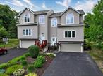 Welcome Home! This pristine townhome in the highly desirable Strawtown Farms neighborhood is everything you are searching for. Walk in to a light-filled, inviting home featuring an open floor concept: living room with gas fireplace, large windows that allow plenty of natural light; use the wall sconces in the large dining area for ambiance while entertaining. The eat-in kitchen features large, custom pantries with floor to ceiling doors, SS appliances, double sinks, granite counters. and brand new sliding doors leading to a private deck, great for al fresco dining. A spacious coat closet and a powder room complete the first floor. Walk up to a bright loft/hall area with lots of possibilities: home office, sitting area, etc. The primary bedroom includes a walk-in closet, cathedral ceiling, large window with seasonal mountain views and a barn door to your en-suite bathroom with soaking tub. The second bedroom has its own en-suite bathroom as well as a cedar lined walk-in closet and ceiling fan. The finished lower level provides many possible uses: laundry room, two-car garage with additional storage closet and a large driveway (comfortably fits 4 large vehicles) This home&rsquo;s location in a quiet cul-de-sac provides you entry to the exclusive Woodbury Parks: Earl Reservoir and John Burke Pool offering swimming, boating, fishing, ball parks, dog park, pavilions, and summer camps. The top rated Monroe Woodbury schools offer full time kindergarten and before and after school activities. Ideal commuter location with the Shortline express NYC bus and just 5 miles to I87, Route 6, Route 17, and famed Woodbury Common. Minutes from West Point, Stewart International Airport, Storm King Art, Bear Mountain and so much more. Improvements: Roof 6/2020, Water softener 7/2023, Heat/AC 7/2019, Hot Water Tank 5/2021.  This GEM won&rsquo;t last!