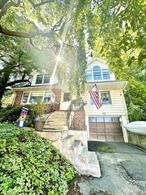 Trees will be trimmed! This home is a true steal with an absolutely amazing private yard in a very quiet neighborhood and picturesque views of the mountains and NYC. This home has it all, oversized bedrooms, large eat- in- kitchen, dining room, living room with a fireplace, 2 full bathrooms, finished basement with a laundry room and access to a 1 car garage. Wood floors are stunning in a perfect condition!The main level floor features two bedrooms and 1 full bathroom with oversized closets. The second floor features two master bedrooms with a double sink full bathroom, master closets, dan and plenty of extra storage. The home is very bright with lots of wooden windows in an excellent condition! Lots of wooden cabinets and a pantry. The fully finished basement features 500 sq ft, a bar, laundry room and a lot of closet space. Enjoy the private yard with a wooden deck and a 6 person hot tub. Don&rsquo;t miss the opportunity and book your showing today. Call Maggie for a private showing @845-709-0138