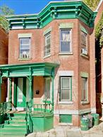 CHARMING TWO FAMILY BRICK HOME - FULLY OCCUPIED INVESTMENT OPPORTUNITY. Step into timeless charm in this classic two family brick building, built in 1910 and thoughtfully updated in 2021. Each unit features two spacious bedrooms, a generous sized eat-in kitchen and a renovated bathroom that blends comfort with modern convenience. Recent updates ensure peace of mind for the next owner while the brick exterior offers lasting curb appeal. Updates include renovated kitchens and bathrooms, vinyl flooring and updated electric. Although natural gas is available, the building is fully powered by electricity. Tenants are responsible for their own heat, hotwater, and electric usage, while the landlord only covers the common area electricity. Covered front porch & full private backyard with rear access from Apartment 1. Located in a desirable area with strong rental history, this property offers both income and potential. Don&rsquo;t miss this opportunity to own a piece of history with modern updates already in place. Known for its rich architectural heritage, vibrant arts scene and sweeping Hudson River views, Newburgh is a city on the rise. Close proximity to major highways including I-84, New York State Thruway, Route 9W, Newburgh Beacon Bridge, as well as the Metro North Station in Beacon, and Stewart Airport.