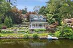 Spectacular Lakefront Jewel. Stunning Lakehouse in a breathtaking waterfront setting. One of the original lakehouses, circa 1926, painstakingly renovated and updated. Meticulously detailed and timeless interior spaces with Plain English designed Kitchen, custom millwork, steel casement windows, Galbraith & Paul wall coverings and bespoke fixtures and fittings. Beautifully finished Living Room with painted paneling, skylit vaulted ceiling, dry bar and fireplace with mirror on an electric lift concealing the television. Chefâ€™s Kitchen with bespoke cabinetry, marble countertops, Aga Range, copper and farm sinks and center island. Open to the Dining and Breakfast Area with doors out to the deck as well as the garden, both with jaw-dropping panoramic views. Private Primary Suite with two Walk-in closets and Bath. Two additional Bedrooms. Exceptional grounds with terraced gardens separated by incredible stone walls. Ample water frontage with a durable Wolf PVC dock allowing for easy swimming, boating, paddleboarding and kayaking. Walk to the community beach. Peaceful and serene setting yet with easy access to the shops, trains and commuting arteries. Absolute perfection!