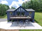 Welcome to your modern country retreat! This beautifully maintained 2-bedroom, 2-bathroom ranch home offers the perfect blend of comfort, efficiency, and outdoor living on 4.82 private acres in the heart of the Sullivan County Catskills.Built in 2017, this 1, 400 sq ft home features an open-concept layout with recent 2024 updates, including new flooring, sliding doors, a refreshed primary bedroom, and a stylish kitchen upgrade. A first floor bonus room can be utilized as a home office or fitness area. Stay comfortable year-round with efficient electric heat, a cozy wood stove, and a newly installed mini-split air conditioning system.Step outside to enjoy a freshly poured concrete patioâ€”perfect for entertainingâ€”with electric hookup ready for your home spa or hot tub. The land is a nature loverâ€™s dream, with a custom-built chicken coop, established hunting food plot, and two wells providing flexibility and abundance.Car enthusiasts or hobbyists will love the spacious 2-car drive-under garage, providing ample storage and workspace. Enjoy the peace and privacy of country living while being just minutes from the charming village of Jeffersonville and centrally located between Callicoon, Narrowsburg, Livingston Manor, and Roscoe.Whether youâ€™re looking for a full-time residence, vacation getaway, or homesteading opportunity, 178 Grebel Road offers the best of Catskills livingâ€”modern comfort, outdoor beauty, and small-town convenience.