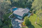 A one-of-a-kind resort-style ranch in the sought after Buttonwood Section of Dix Hills with a backyard paradise you&rsquo;ll never want to leave. The sprawling ranch features 4 BRs, 3.5 Baths, and was completely reimagined just 4 years ago. Custom millwork, coffered and tray ceilings, and elegant crown moldings set the tone of quiet luxury from the moment you walk in. Walls of windows in every room make this home bright and inviting. Show stopping chef&rsquo;s kitchen with Wolf appliances, quartz waterfall counters, radiant heated porcelain floors - every detail designed to impress. Spa-inspired baths with radiant heat, frameless glass, and designer finishes feel straight out of a boutique hotel. Private primary tucked away with en-suite and custom closet. Full finished basement offers incredible flex space - full wet-bar, media area, gym, plus a private guest suite with a private bath. Plenty of storage room, utilities and 2 car garage. Backyard - A True ResortThe backyard here is simply unmatched - a resort-caliber oasis where you can unwind or entertain in style. Heated, salt-water pool with twin waterfalls, covered patio with a year round hot-tub, firepit, and full outdoor kitchen with granite & stainless XO appliances. Professionally landscaped corner property offers lush privacy, with sweeping frontage and year round color. All beautifully maintained and designed for low upkeep.This home is a rare gem - one of the most desirable properties in Dix Hills, on its most sought after block. Between the stunning finishes and the spectacular space, it won&rsquo;t last long. Half Hollow Hills SD #5 - Vanderbilt Elementary, Candlewood Middle School, HHH West High School. Roof 5 years, Boiler and Split System 3 years, AC 3 years, Commercial Grade Septic Tank 3 years, Separate cesspool in yard for future pool house, Pool 5 years, Estate Fencing, Anderson Windows 4 years, Kitchen 4 years, Water Purifier (Owned), Outdoor Kitchen with XO appliances 4 years, Sonos Speakers, 200 Amp, 3 Zone Heat, 2 Zones Radiant (Kitchen and 2 Baths), Central Air 3 years, Ductless in Basement, Sprinklers front and back.