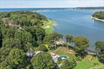 Welcome to Your Private Waterfront Paradise in beautiful and historical hamlet of Strong&rsquo;s NeckExperience a rare opportunity to own a newly renovated 3-bedroom, 2.5-bath wide-line ranch nestled on 2.6 acres of pristine waterfront property with 205&rsquo; of private beach access and a separate deeded acre that can be kept as a buffer for privacy or future building possibilities. The property has sweeping, unobstructed views of both Setauket and Port Jefferson Harbors, this exceptional home offers luxurious living in a serene, natural setting. The home was designed with an open-concept layout, with large windows that flood the living space with light and showcase breathtaking water views from nearly every room.A gated private driveway leads to the home, offering both security and a grand sense of arrival. Enjoy a seamless indoor-outdoor lifestyle: lounge by the in-ground pool overlooking the harbor, host gatherings on the meticulously maintained, level grounds, or relax on your own private beach. For boating enthusiasts, a town-permitted mooring allows you to keep your boat in full view from your backyard.Additional highlights include a finished basement with access to a 2-car garage below, This is more than a homeâ€”itâ€™s a lifestyle. Privacy, beauty, and coastal elegance await.Pictures can not possibly give the true impact of viewing this property in person. Schedule your private showing today!This is more than a homeâ€”itâ€™s a lifestyle. Privacy, beauty, and coastal elegance await.