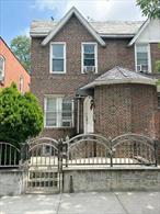 Beautifully maintained brick semi-detached home featuring 3 spacious bedrooms 2 baths, and a convenient powder room on the first floor. The open-concept main level offers a generous living room, formal dining area, and an eat-in kitchen with sleek new finishes. Enjoy hardwood floors throughout, recessed lighting, and stylish fixtures. A fully finished basement with separate entrance and a bathroom is ideal for creative entertainment, or office space. Additional perks include steam heat, gas utilities, in-unit washer/dryer, and a gated private driveway leading to a rare two-car detached garage. Outdoor living is complete with a fenced front yard and a paved backyard perfect for gatherings. Conveniently located near schools, local playgrounds, and minutes from shopping and dining on Astoria Blvd and Northern Blvd. Excellent transit access via Q33 bus to the 7/E/F/M/R trains at Roosevelt Ave, Q19 to Flushing, and close proximity to Grand Central Parkway (Exits 5&6) and La Guardia Airport.