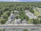 Calling all INVESTORS!!Discover 669 Flanders Road in Riverhead  An exceptional 1.5 ACRE property offering endless possibilities for investors and entrepreneurs alike.  A busy roadway that serves as a key connector between major highways, channeling traffic from the HAMPTONS to the NORTH FORK.This versatile property features a charming 3-bedroom residential home with steady current rental income, as well as a leased commercial building, both on month-to-month tenants. Included is spacious vacant land accessible from Flanders Road, with potential for subdivision to create additional residential units or expand your portfolio. The property also offers the opportunity to develop a 7, 000 sq ft commercial building perfect for an array of business opportunities, large retail space, or storage facilities.Strategically located with approximately 22, 000 vehicles passing daily and a bus stop right in front, this site boasts excellent visibility and high traffic flow. Whether you&rsquo;re looking to establish a thriving business, expand your real estate holdings, or develop a mixed-use property, 669 Flanders Road provides limitless potential in a prime Riverhead location. Don&rsquo;t miss this unique opportunity schedule a viewing today!