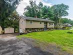 Welcome to this beautifully maintained 3-bedroom, 2-bath split-level home, nestled on a quiet private dead-end road in Wallkill, NY. Set on a peaceful lot, this home offers both comfort and convenience with a layout ideal for everyday living and entertaining.Step inside to find a bright and inviting living space that flows seamlessly into the dining area and kitchen. The upper level includes three spacious bedrooms and a full bath, while the lower level features a cozy den or family room, an additional full bath, and access to the garageâ€”perfect for storage or hobbies.Enjoy the outdoors on the expansive back deck, ideal for summer barbecues, morning coffee, or gathering with friends. The private setting provides just the right mix of tranquility and accessibility.Located in the heart of the Hudson Valley, this home puts you minutes away from outdoor adventures and local attractions. Explore nearby Shawangunk Mountains, hike the trails at Minnewaska State Park, or spend the day picking fresh fruit at local U-pick farms and orchards. For food lovers, you&rsquo;re just a short drive to craft breweries, wineries, farm-to-table dining, and the vibrant village of New Paltz. Commuters will appreciate proximity to major highways and public transportation options.Donâ€™t miss the opportunity to make this home your own in a location known for its natural beauty, local charm, and easy lifestyle.