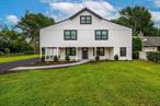 Welcome to this beautifully updated 5-bedroom, 2.5-bath colonial nestled on a massive 100x200 lotâ€”just shy of half an acre! This spacious home features two king-size bedrooms, each boasting walk-in closets for ample storage. The primary bedroom includes a private en-suite bathroom for ultimate convenience and privacy.Upstairs, youâ€™ll find gleaming hardwood floors that add warmth and character throughout the space. Recent updates include a brand-new roof and siding, ensuring both style and durability.Enjoy the expansive yard, perfect for outdoor entertaining, gardening, or simply relaxing in your own private retreat. Donâ€™t miss the opportunity to own this move-in ready home with plenty of space to grow!Everything is brand new, electric, plumbing, siding, roof, windows. This property is a must see!